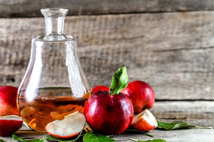 Apple vinegar or cider, bottle of drink and fresh apples, healthy organic food concept